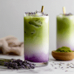 Iced lavender matcha latte recipe with layered green tea and lavender milk in a tall glass