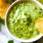 Fresh Avocado Tomatillo Salsa served in a bowl with tortilla chips