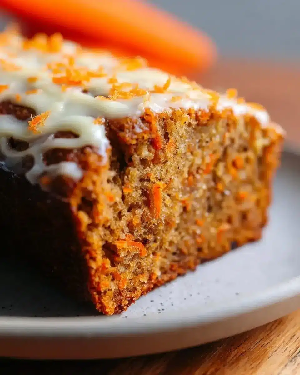 Delicious Carrot Cake Banana Bread slice on a wooden board