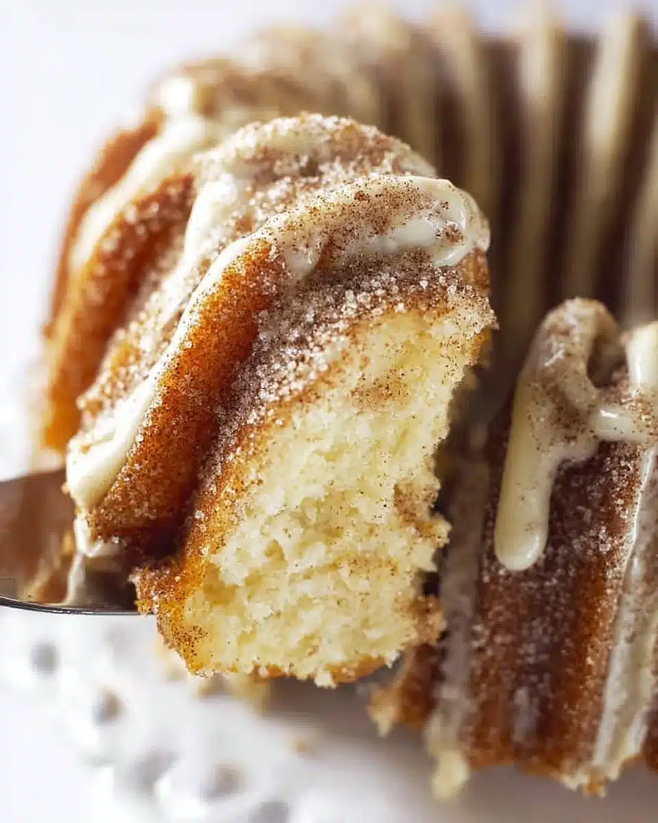 Moist and fluffy Churro Cake topped with cinnamon and sugar
