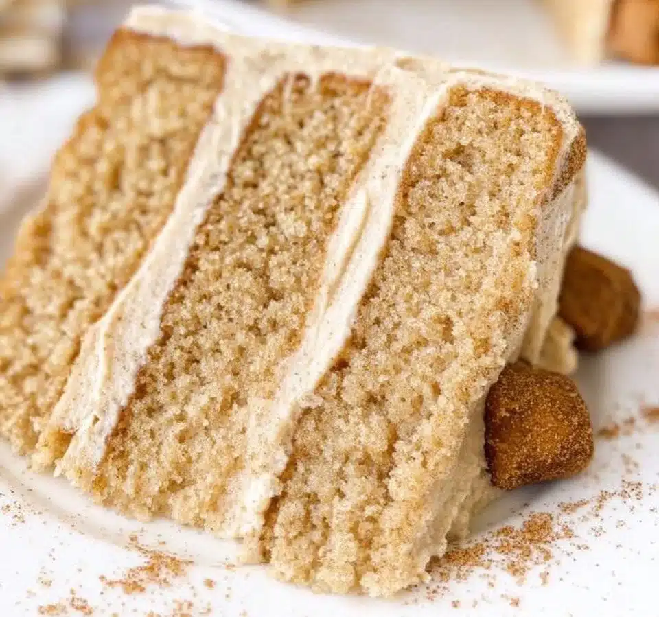 Churro Three Milks Cake topped with cinnamon and whipped cream.