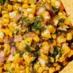 Bowl of homemade Chipotle Chili Corn Salsa with corn, peppers, and spices