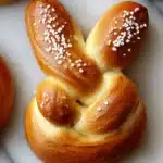 Easter Bunny shaped soft pretzels arranged on a festive platter