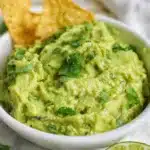 Fresh homemade guacamole served with tortilla chips