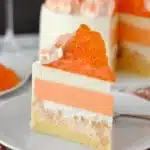 Delicious Orange Creamsicle Ice Cream Cake with a vibrant orange layer and creamy icing