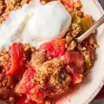 Delicious rhubarb crisp with a crunchy topping on a serving dish