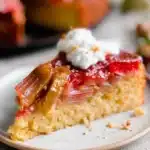 Delicious Rhubarb Upside-Down Cake topped with fresh rhubarb slices.