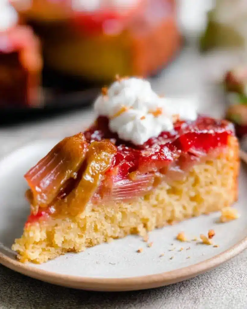 Delicious Rhubarb Upside-Down Cake topped with fresh rhubarb slices.