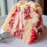 Delicious Strawberry Earthquake Cake topped with fresh strawberries