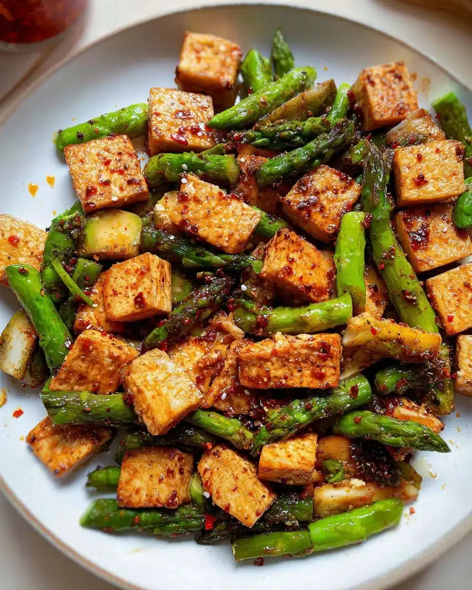 Asparagus tofu stir fry with vibrant vegetables in a pan