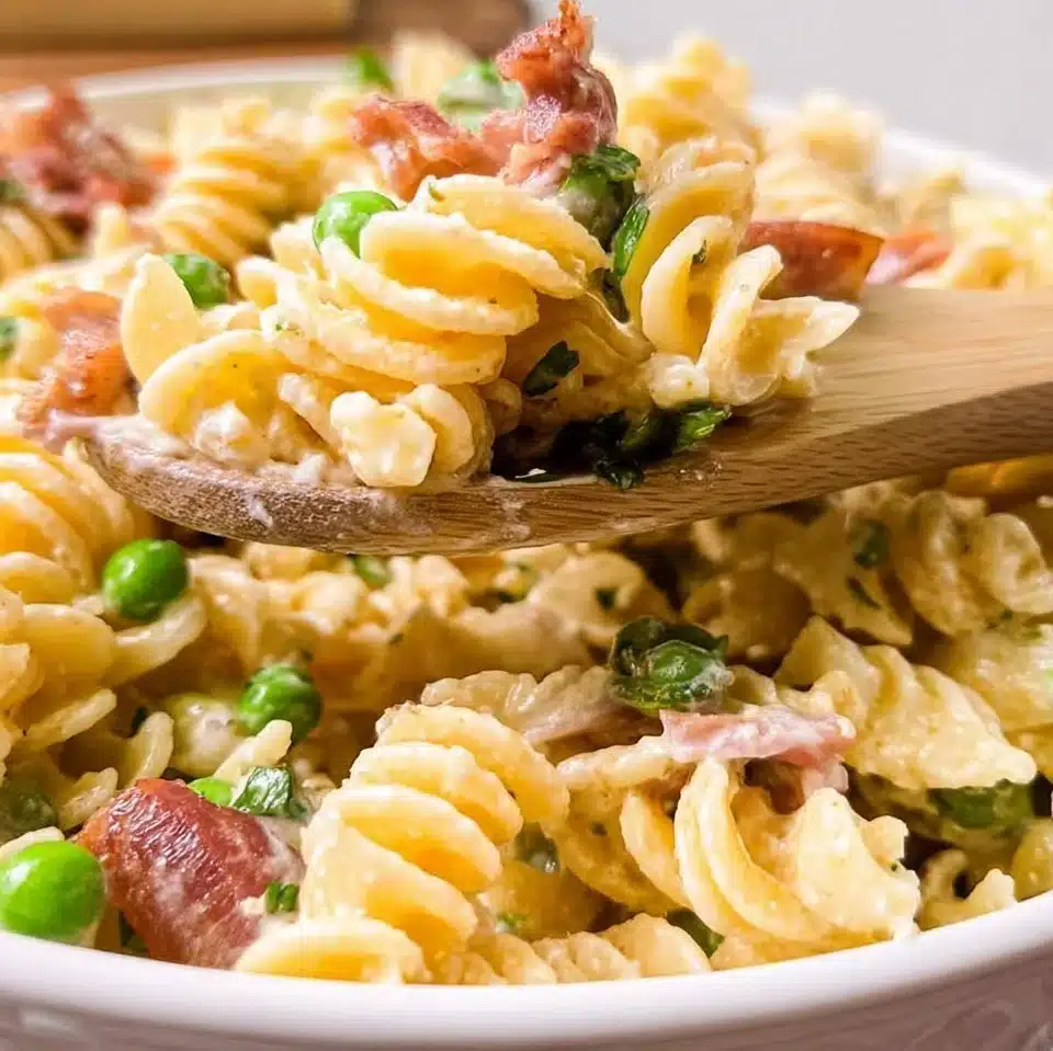 Bacon Ranch Pasta Salad with creamy dressing, bacon, and pasta, served in a bowl.