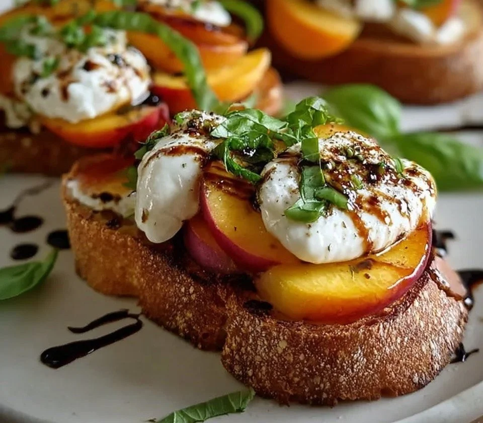 Balsamic Peach and Burrata Toast garnished with fresh basil.