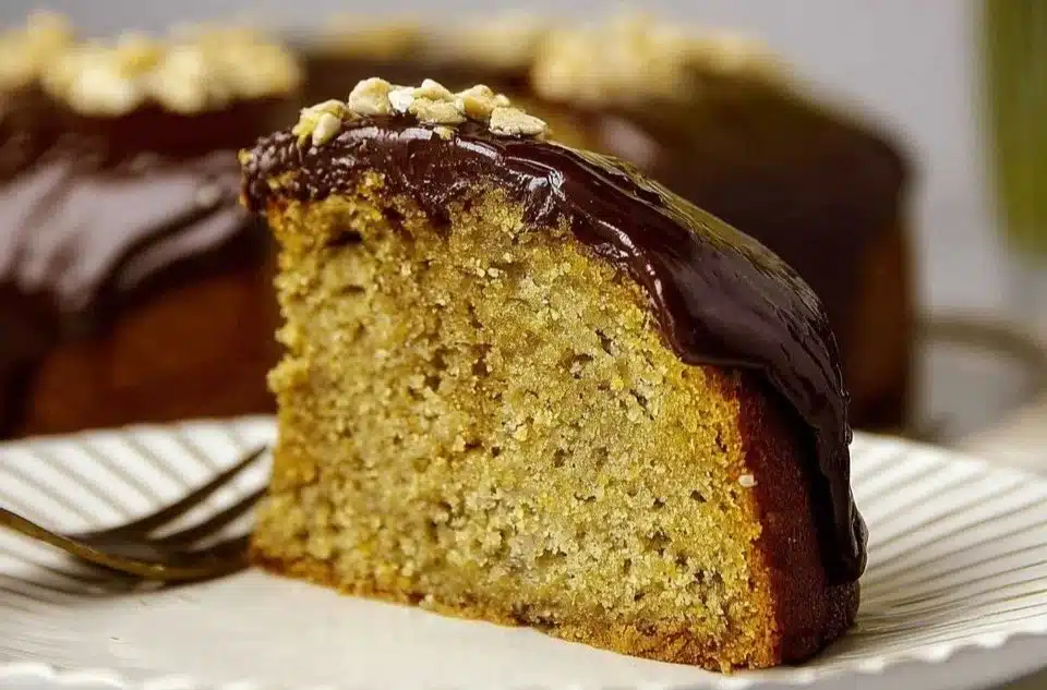 Delicious Banana Olive Oil Cake with slices on a rustic wooden table
