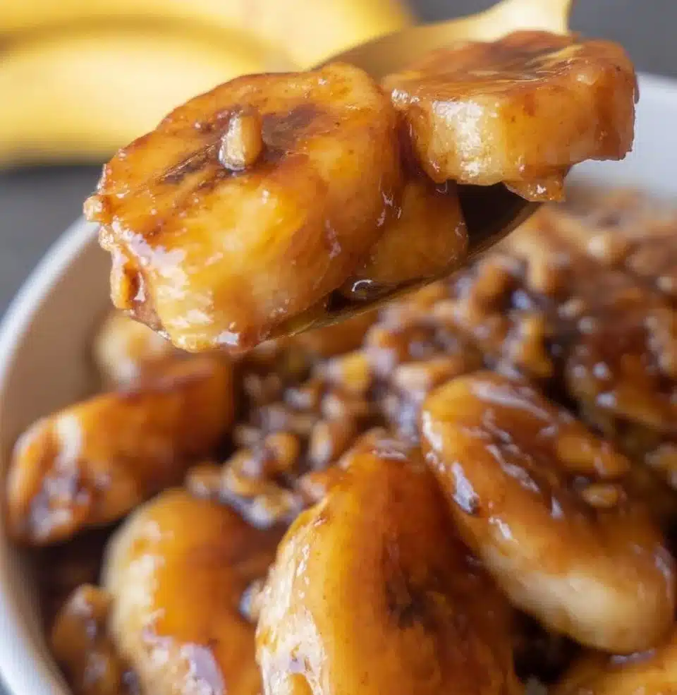 Delicious Bananas Foster dessert served in a skillet with caramel sauce and rum.