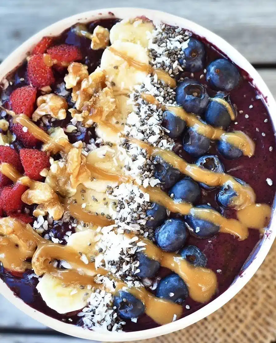 Blueberry Green Tea Acai Bowl topped with fresh fruits and nuts