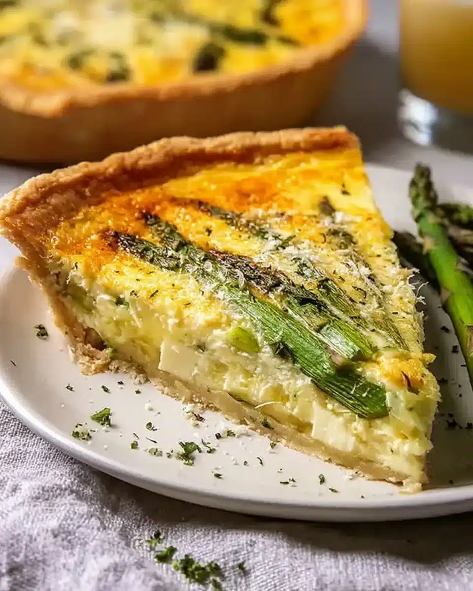 Cheesy asparagus and Gruyere quiche served on a plate