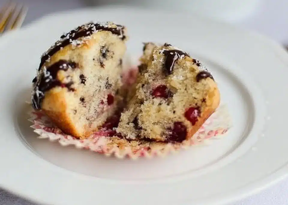 Freshly baked Cherry Chocolate Chip Muffins with cherries and chocolate chips