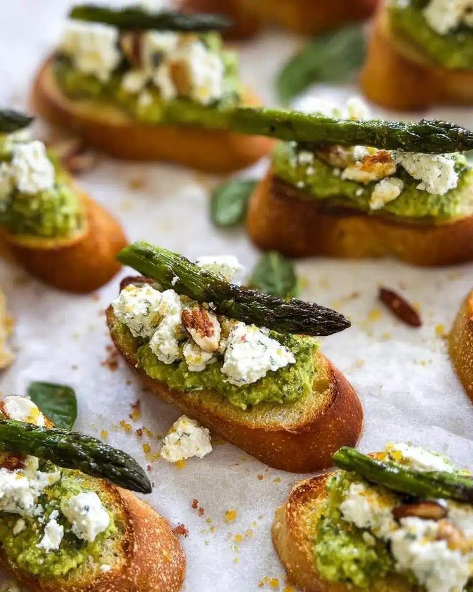 Citrus pesto crostini topped with creamy goat cheese and fresh herbs
