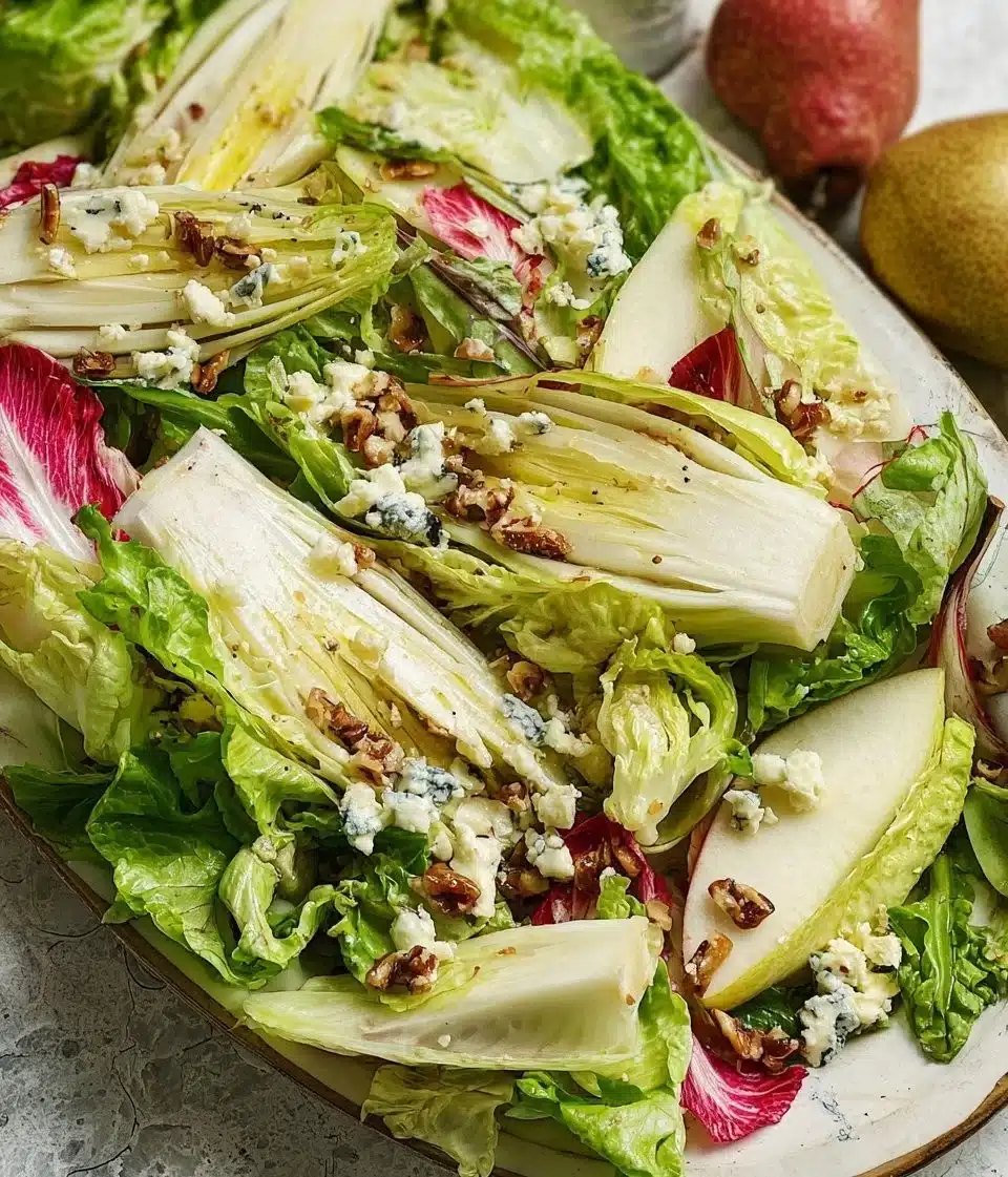 Endive, Pear, and Gorgonzola salad beautifully arranged in a bowl