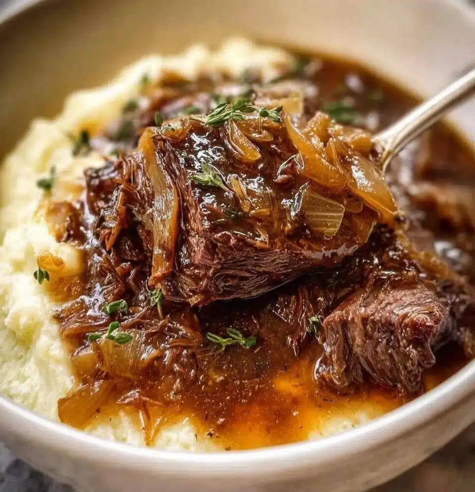 Slow-cooked French Onion Pot Roast with melted cheese and savory onions