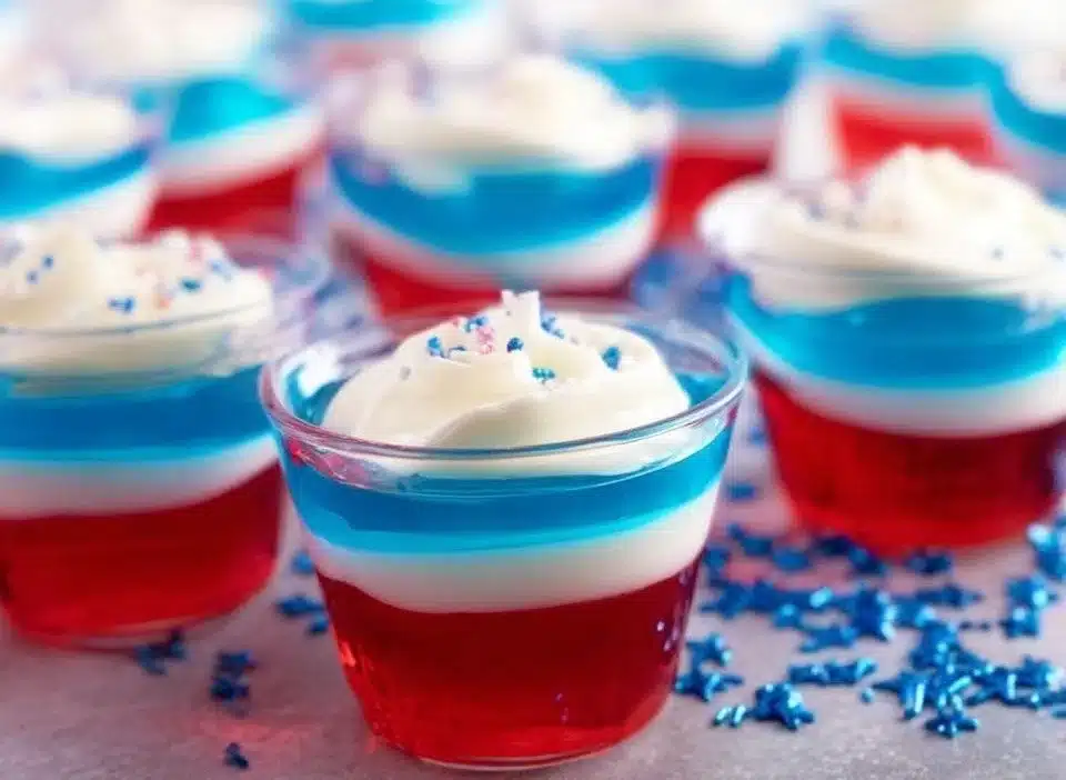 Colorful Jell-O Shots in cups, perfect for parties and gatherings.