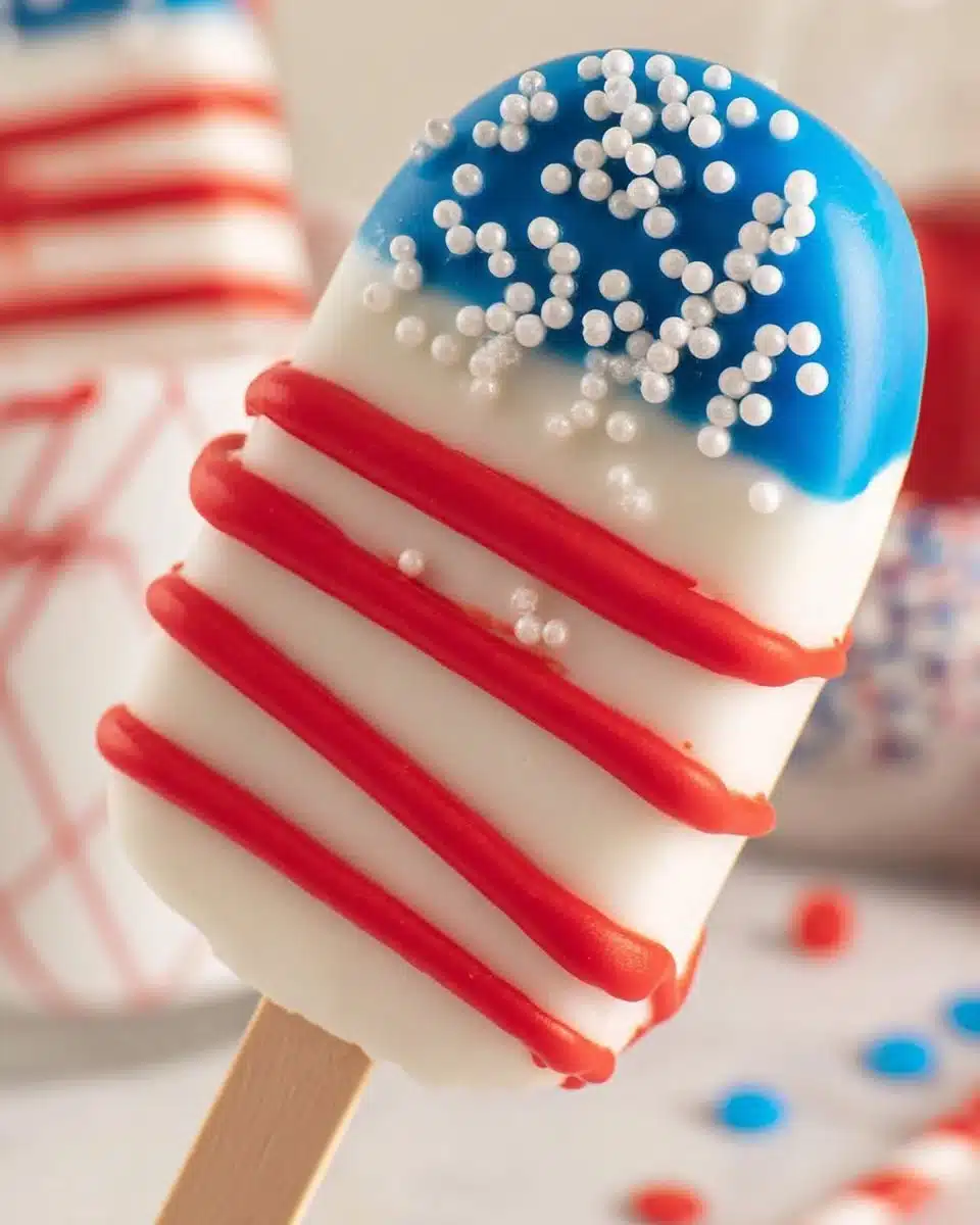 Patriotic Cakesicles decorated in red, white, and blue colors for festive celebrations