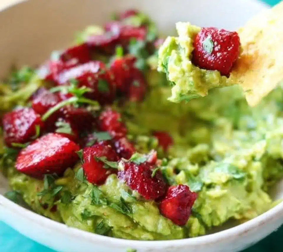 Delicious roasted strawberry guacamole served with tortilla chips