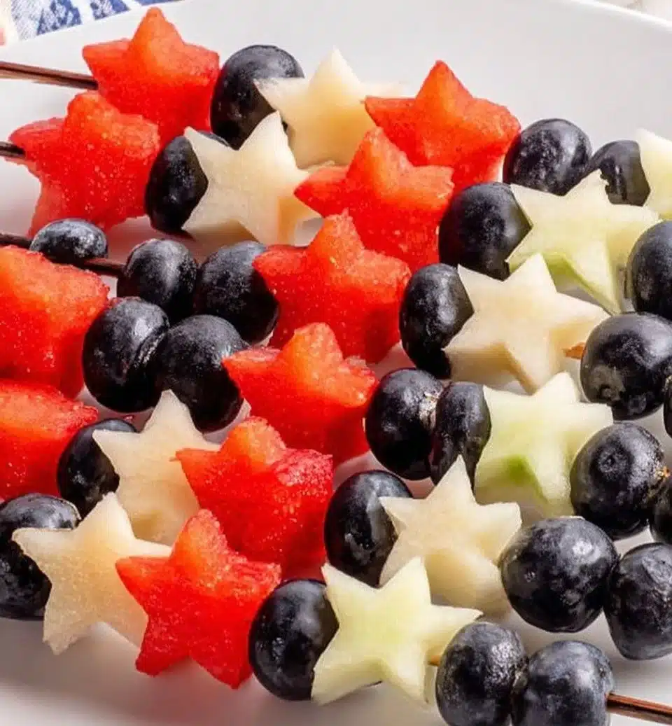 Colorful sparkler fruit skewers arranged for a festive party treat