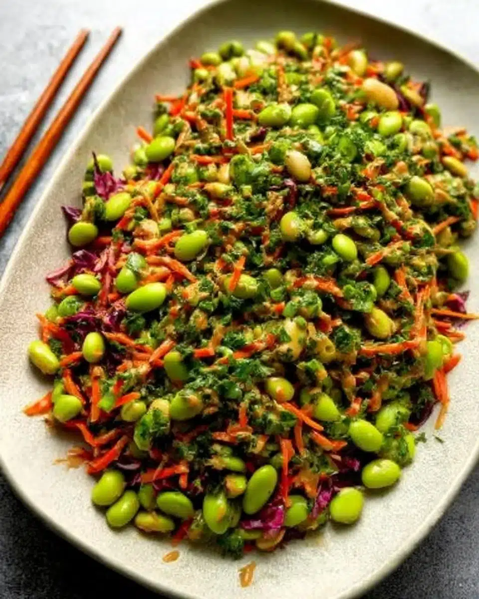 Edamame salad with peanut sauce topped with fresh vegetables