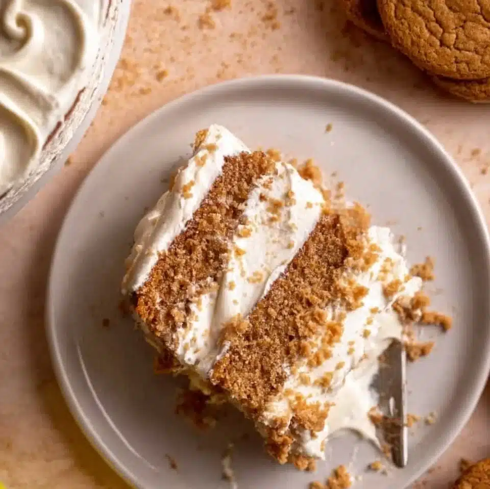 Delicious Oatmeal Cream Pie Cake topped with creamy filling and oatmeal cookies