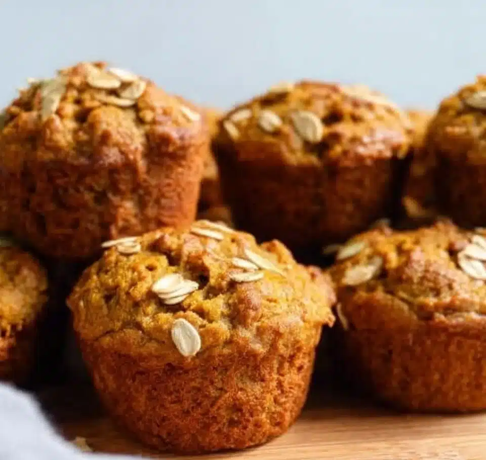 Freshly baked Pumpkin Banana Muffins on a wooden table