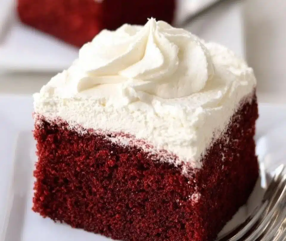 Deliciously decorated Red Velvet Cake on a wooden table