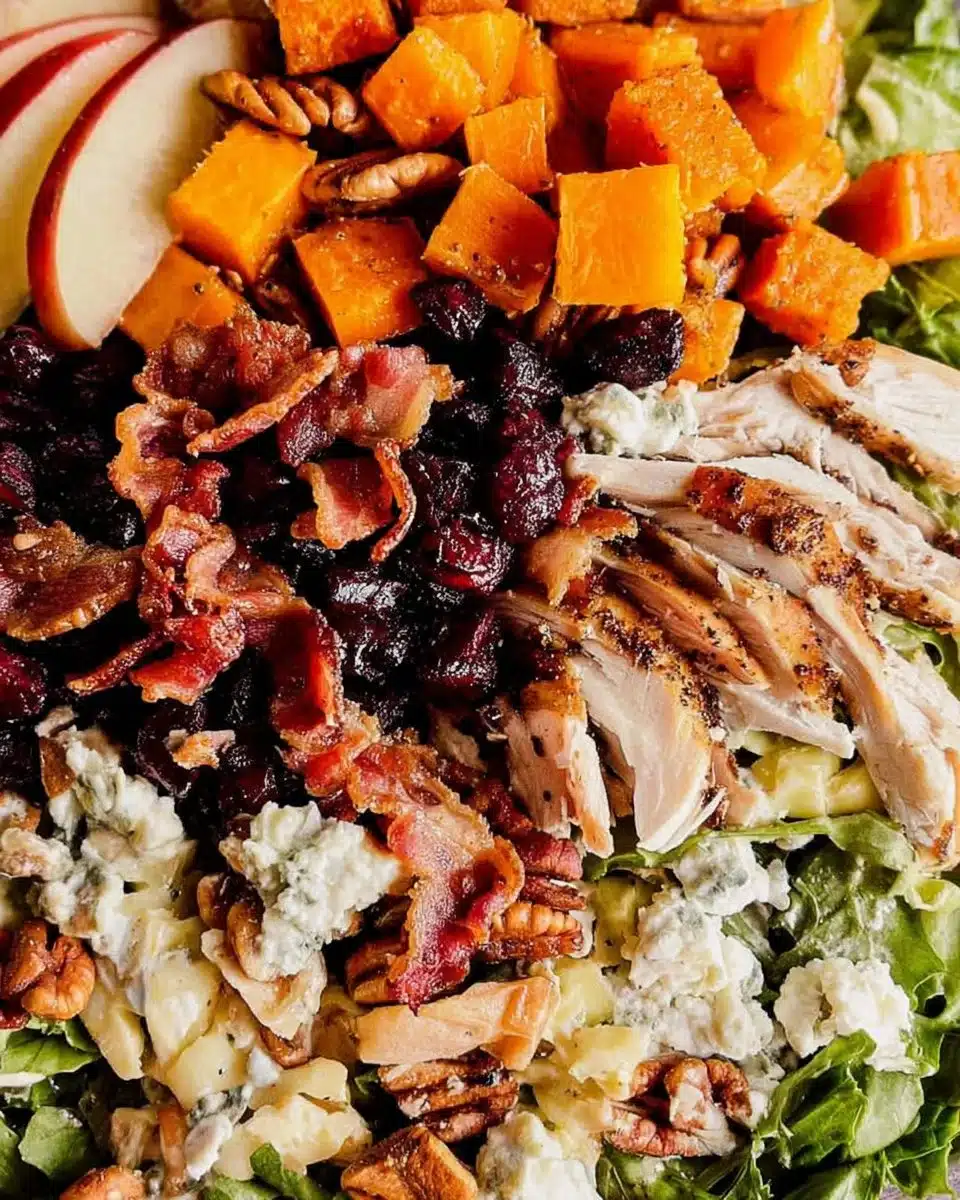 Harvest Cobb Salad featuring fresh greens, butternut squash, and vibrant toppings.