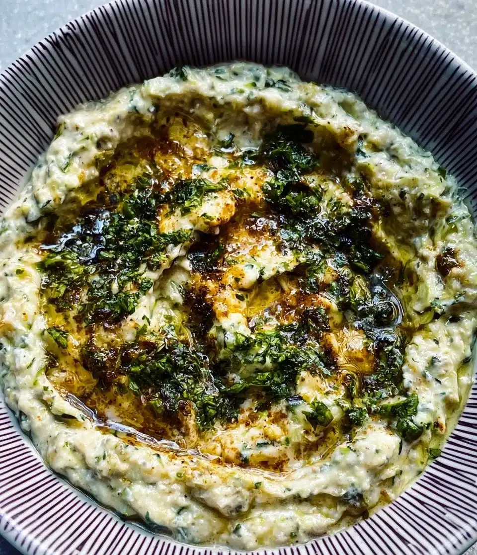 Delicious bowl of Mutabal Kousa with zucchini and spices