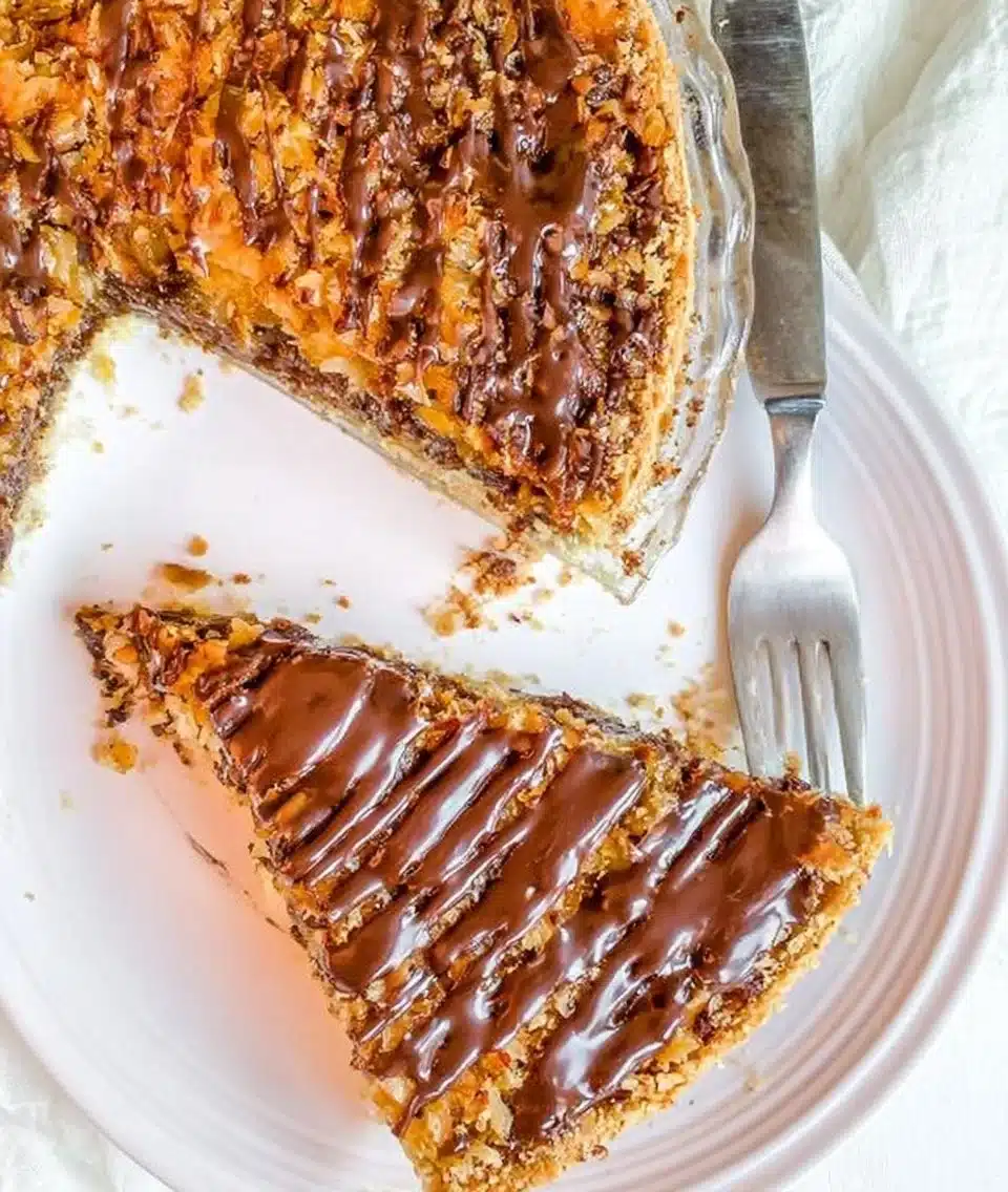Delicious Samoa Pie with chocolate, caramel, and coconut layers.
