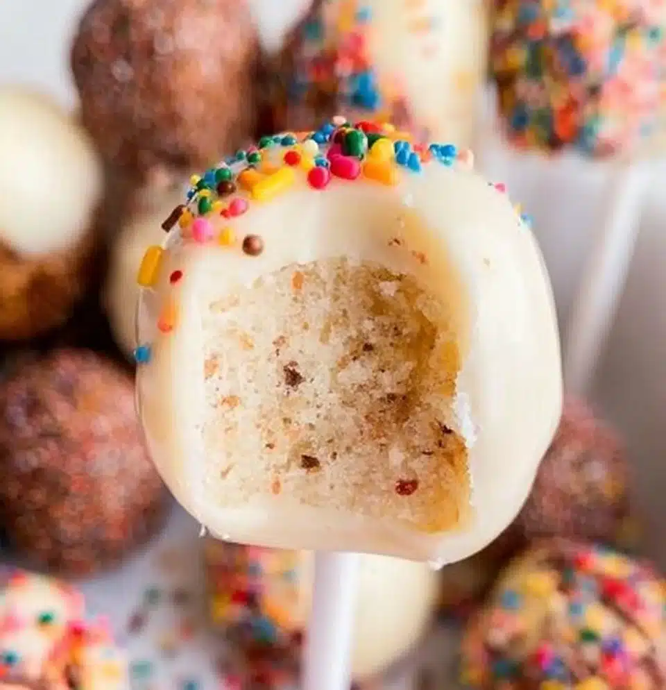 Colorful cake pops on a decorative plate, perfect for celebrations and events.