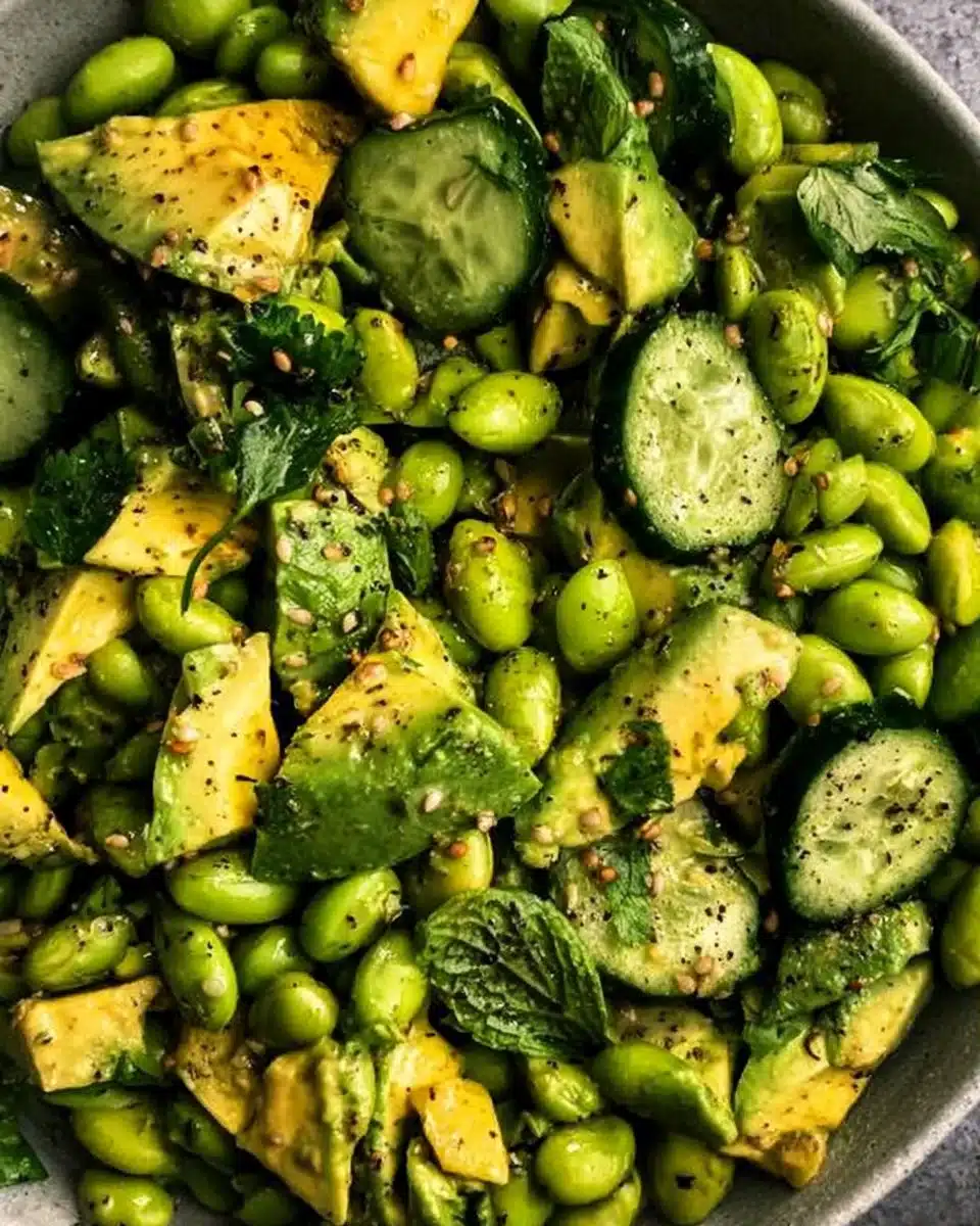Cucumber Edamame Avocado Salad with fresh vegetables in a bowl.