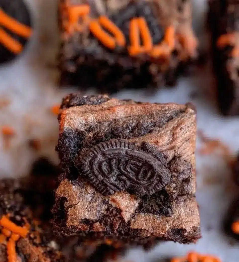 Delicious Oreo Brownies topped with crushed Oreo cookies.