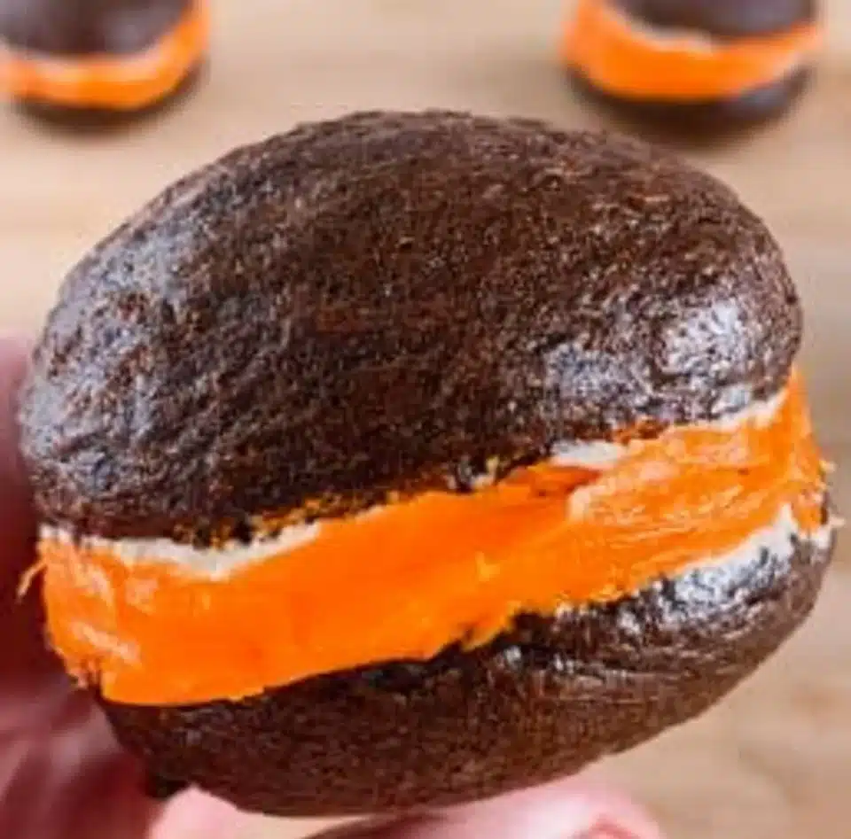 Delicious whoopie pies filled with cream, showcasing their soft, cake-like texture.