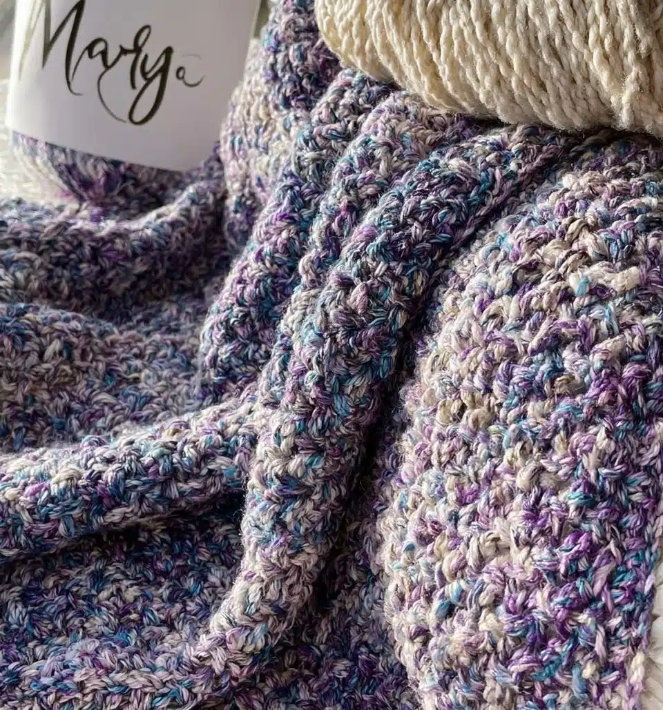 Handmade crocheted shawl in vibrant colors, ideal for any occasion.